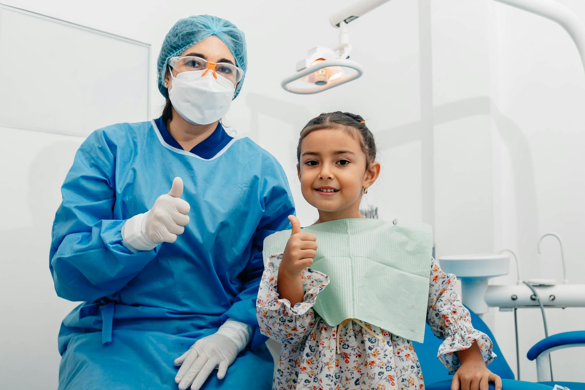 Family dentist Uxbridge child dental checkup thumbs up
